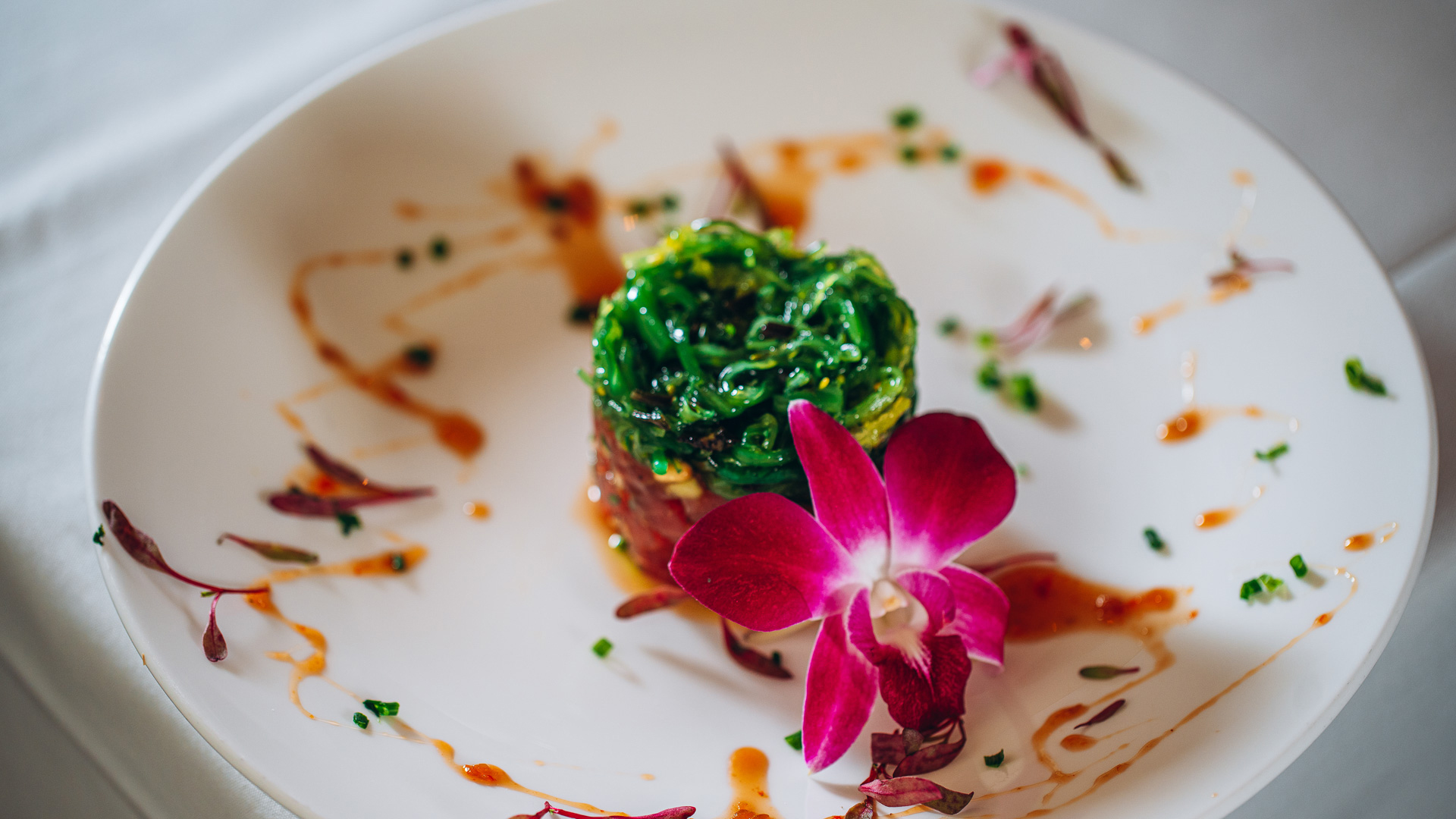 a plate of food with a flower