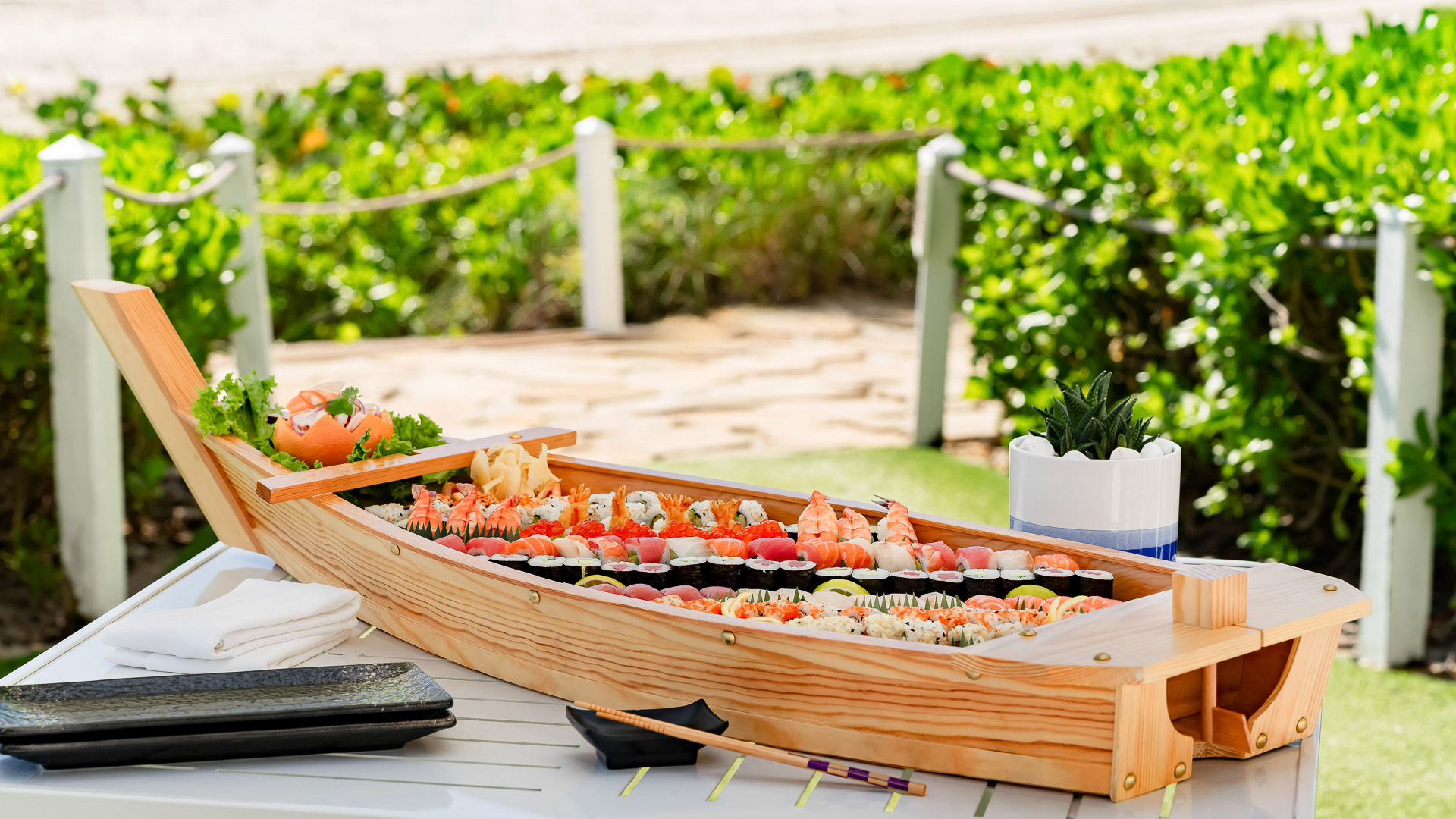 a wooden boat with sushi on it