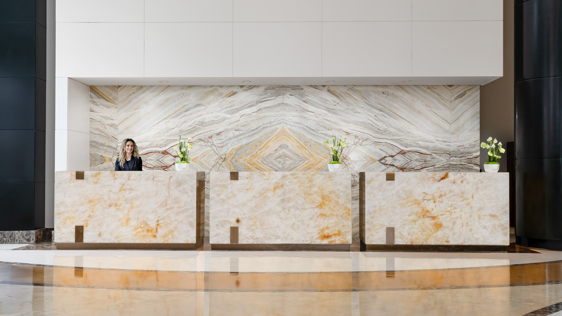 a woman standing behind a counter