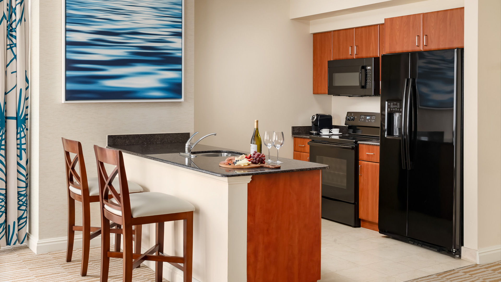 a kitchen with a black stove and a black appliances