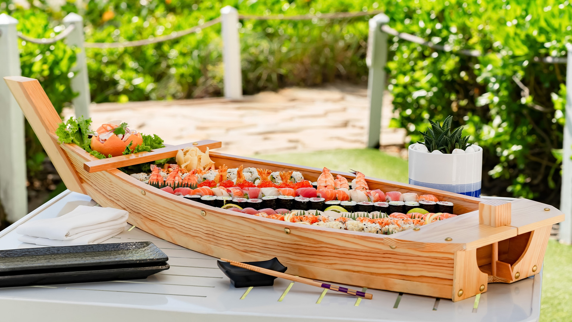 a wooden boat filled with sushi