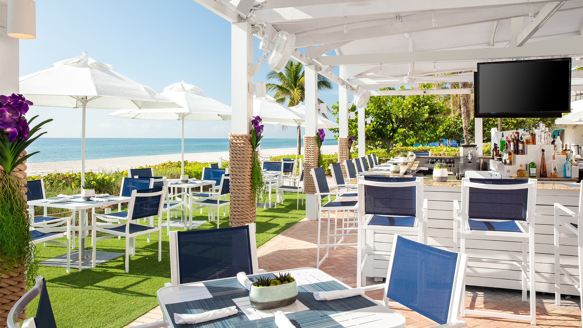a white and blue chairs and tables on a patio