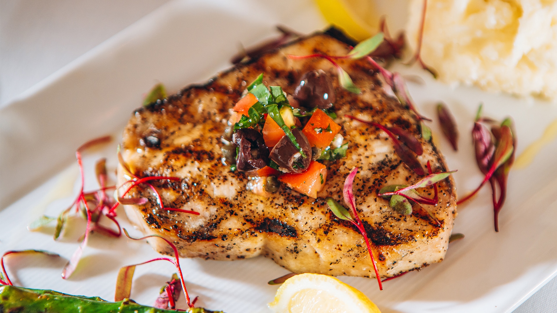 a plate of food with a slice of lemon