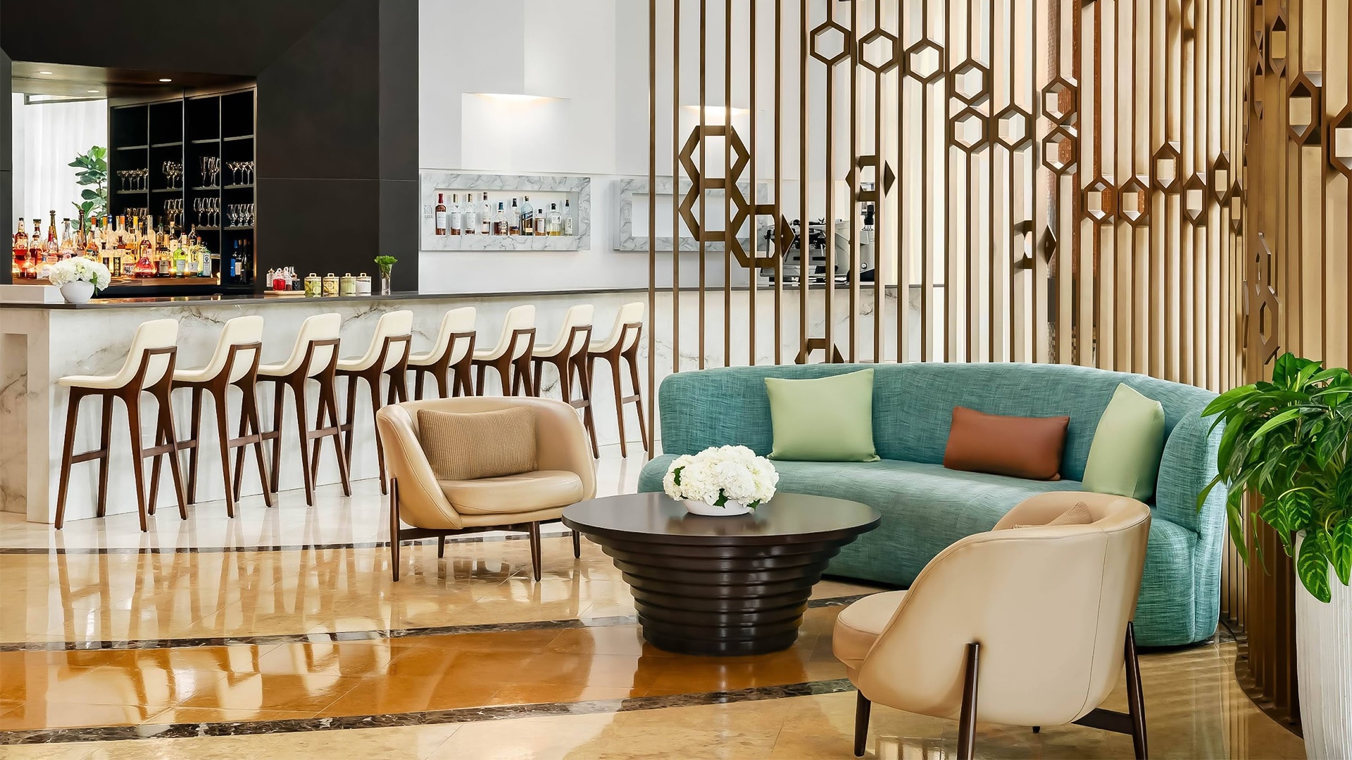 a room with a couch and chairs