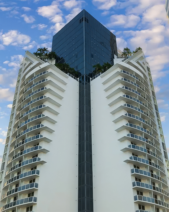 a tall building with plants on top