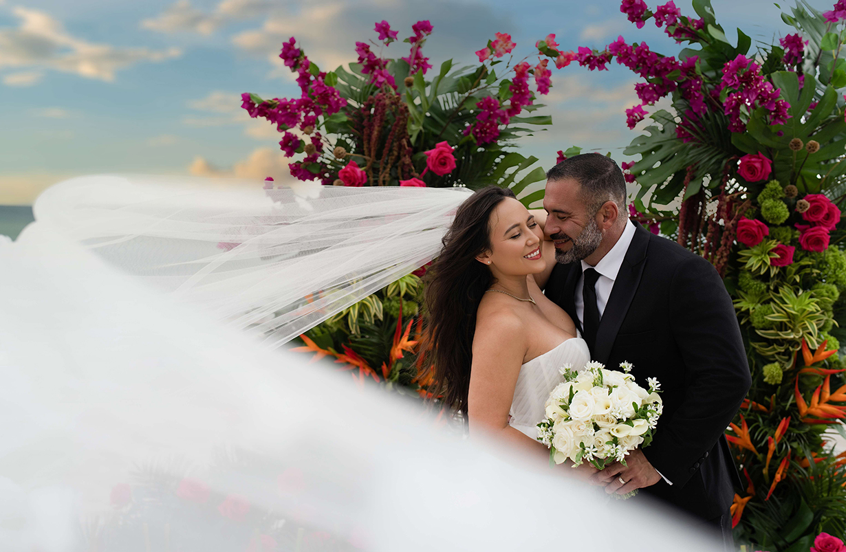 a man and woman in wedding attire