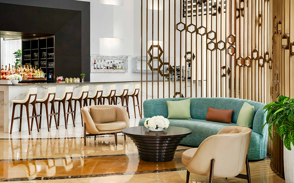 a room with a couch and chairs