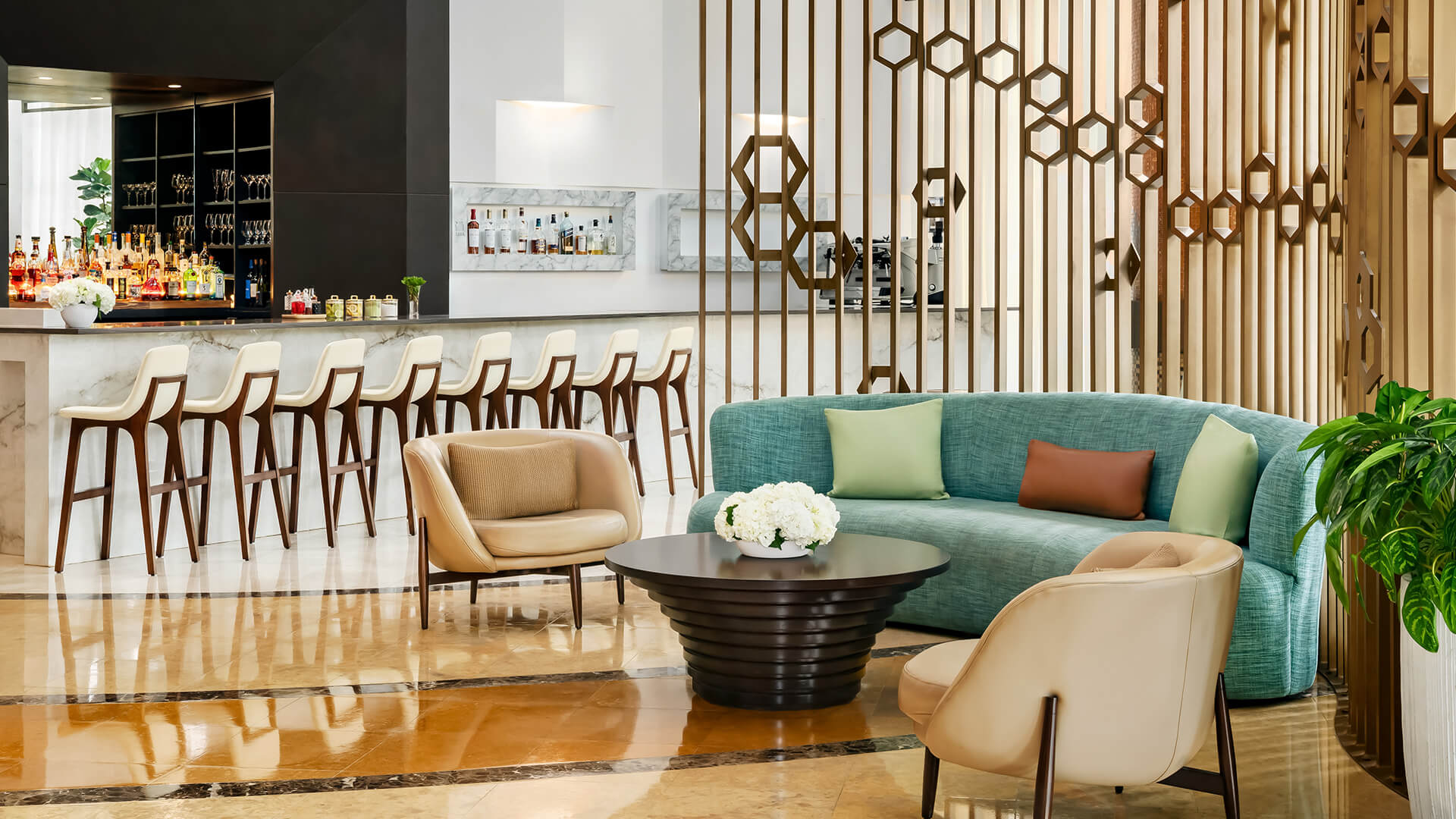 a room with a couch and chairs