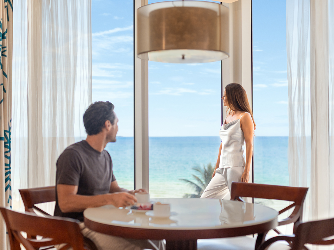 a man and woman looking at each other