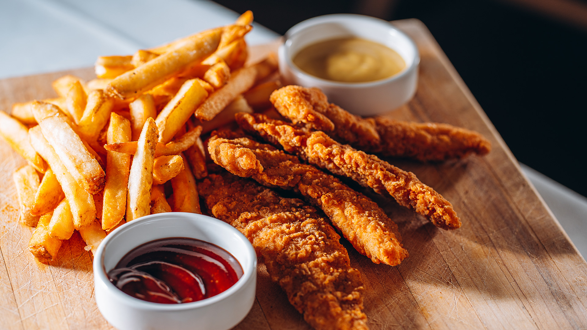 a plate of fried food with sauces
