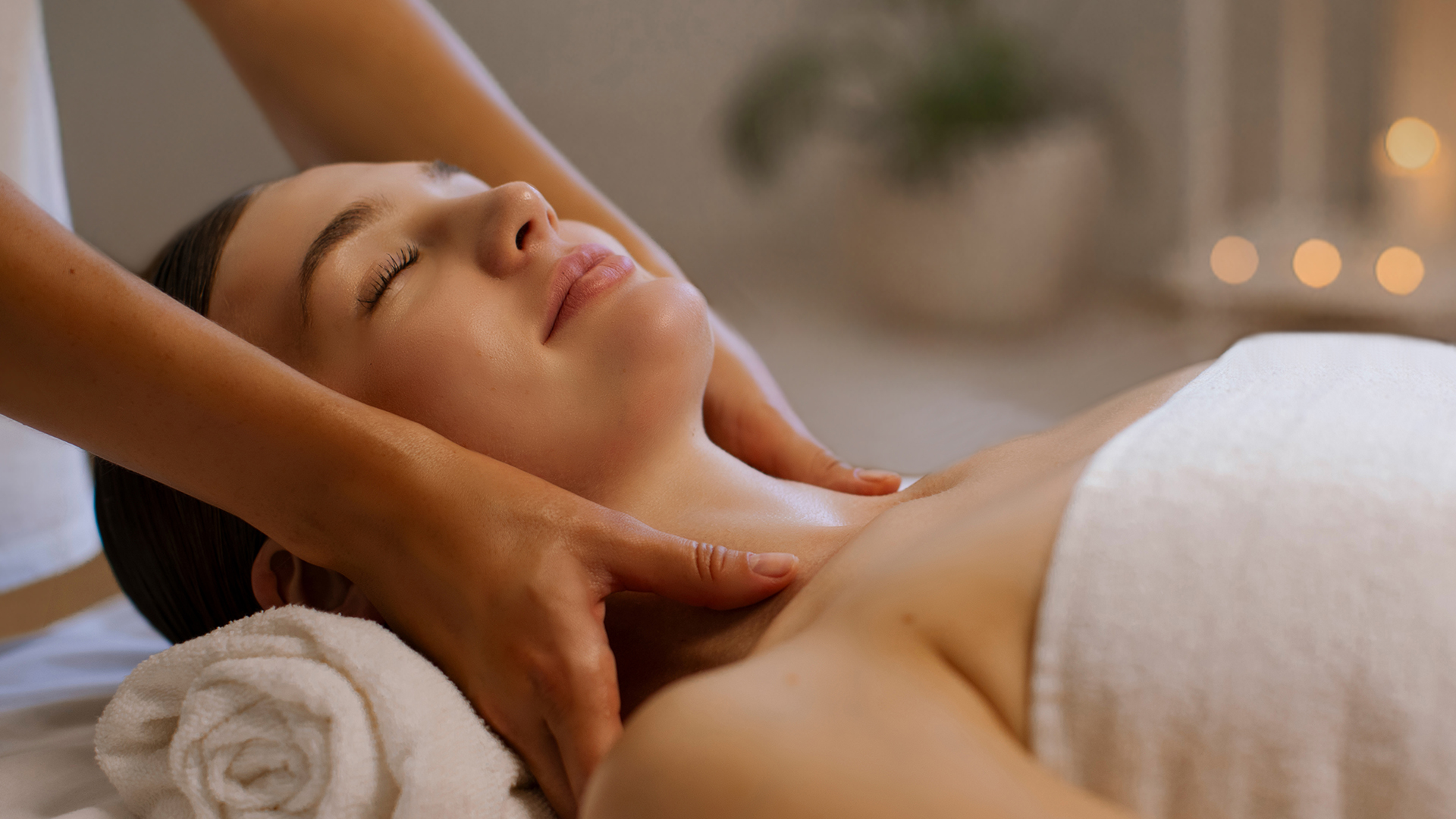 a woman receiving a neck massage