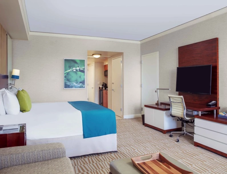 a room with a bed and a desk