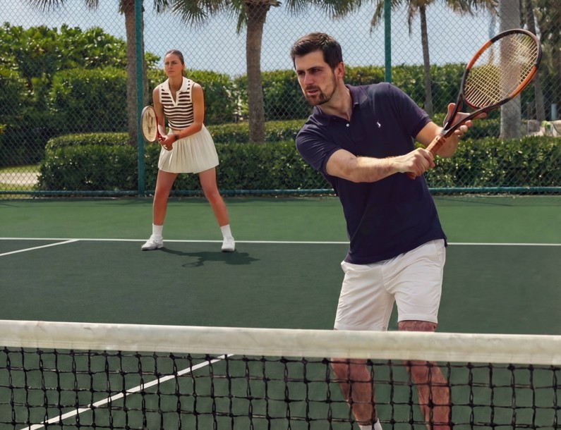 a man and woman playing tennis