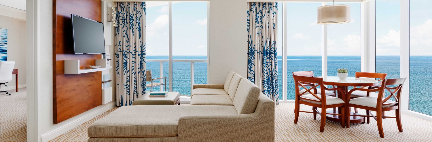 a living room with a television and a table