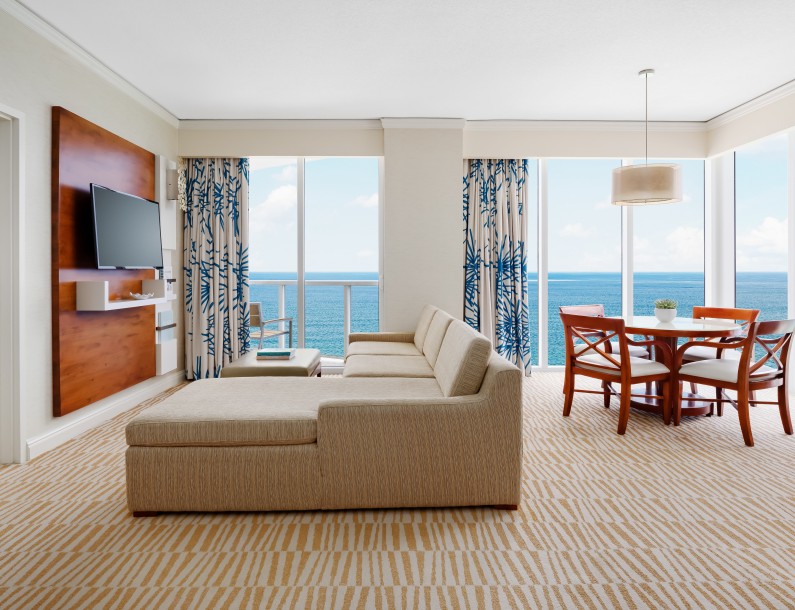 a living room with a television and a table