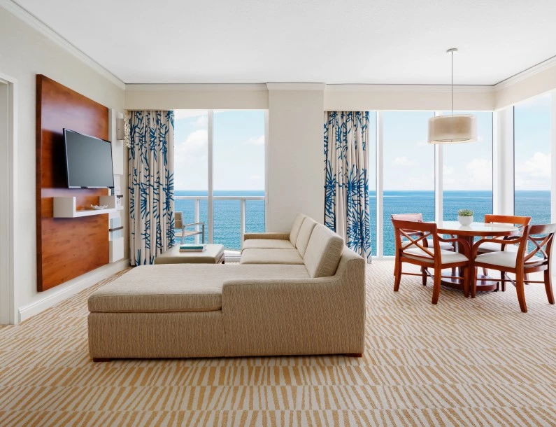 a living room with a television and a table