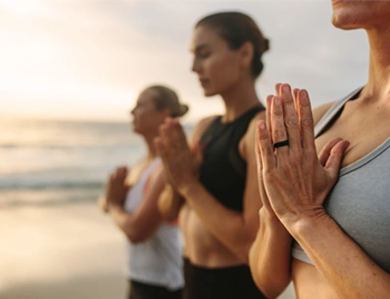 a group of people holding their hands up