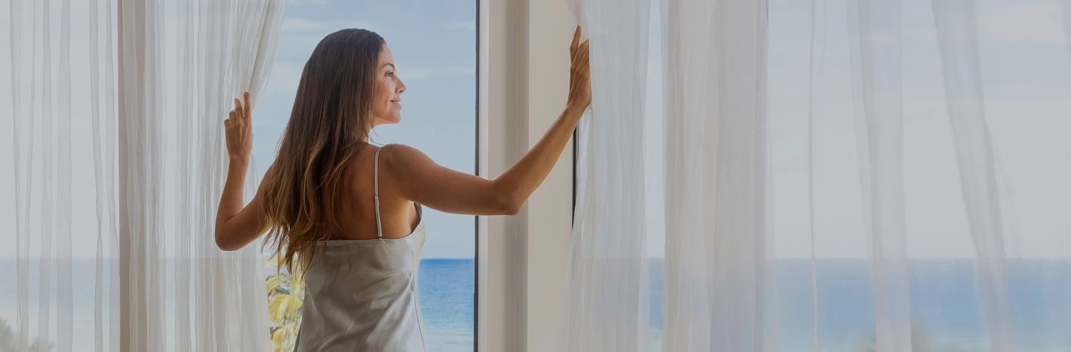 a woman looking out a window