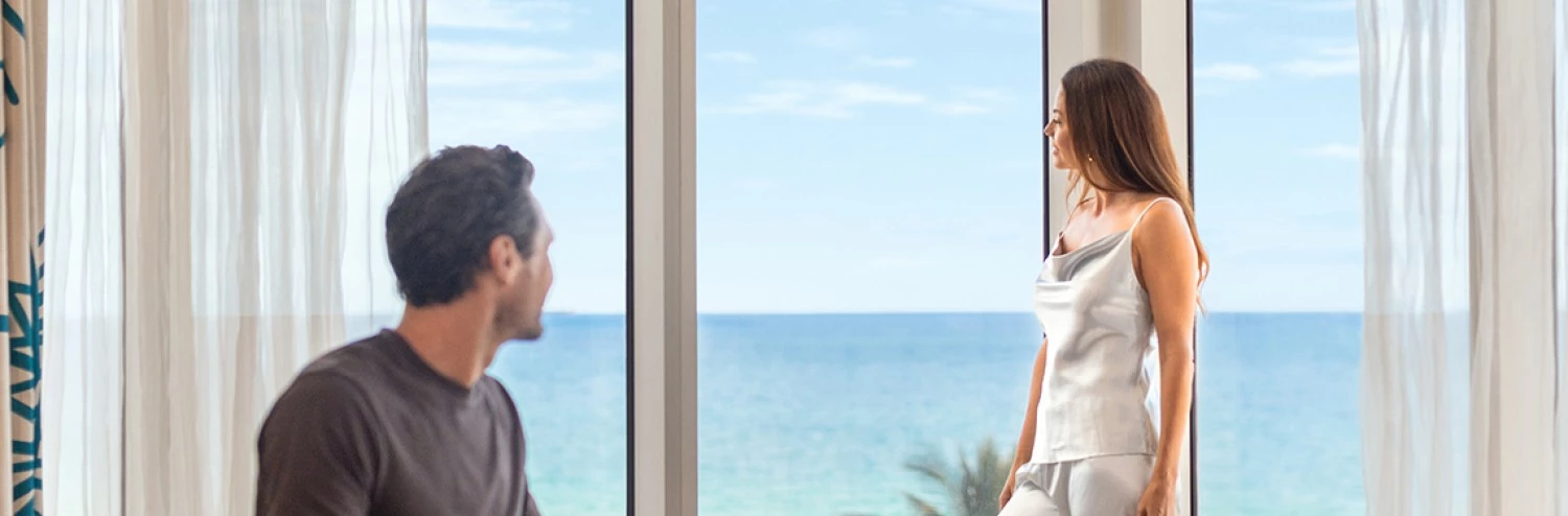 a man and woman looking at each other