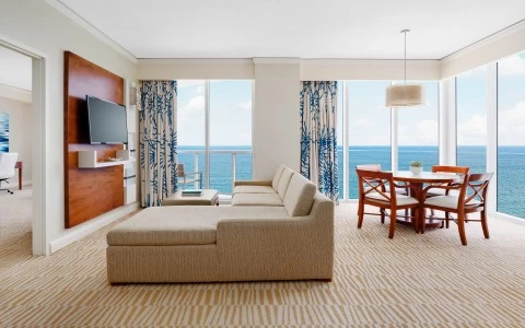 a living room with a television and a table