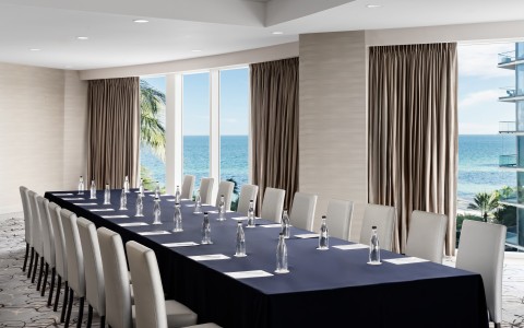a long table with water bottles on it