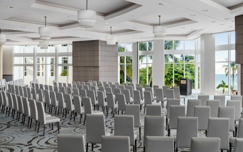 a room with many chairs and a podium