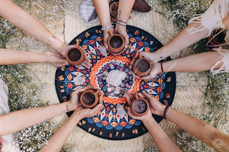 a group of people holding cups