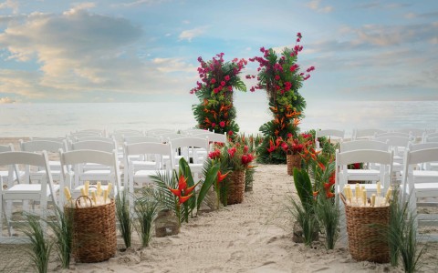 a wedding ceremony set up in the sand