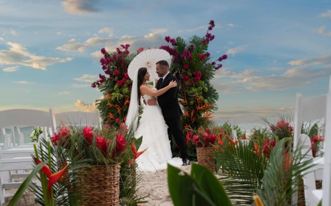 a man and woman dancing in a wedding ceremony