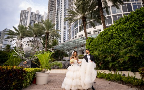 a man and woman in wedding dresses