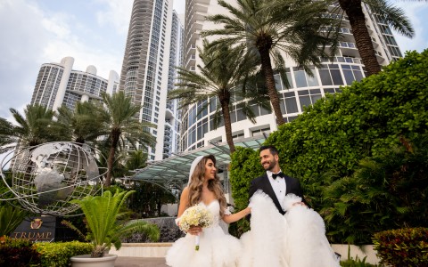 a man and woman in wedding dresses