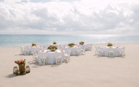 a group of tables on a beach