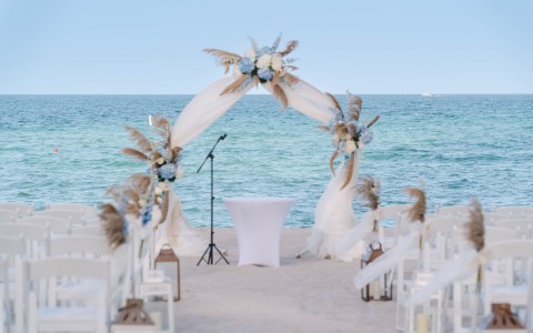 a wedding ceremony set up on a beach