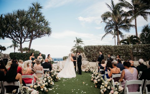 a bride and groom at an outdoor wedding ceremony