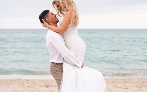 a man and woman on a beach