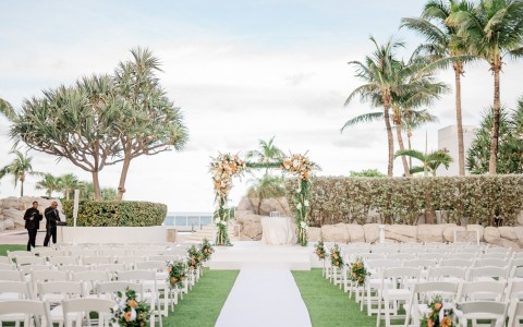 a wedding ceremony set up with chairs and trees