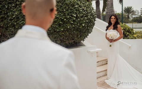 a man in a white suit and a woman in a white dress