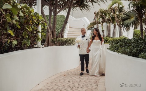 a man and woman walking down a path