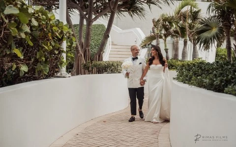 a man and woman walking down a path