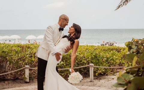 a man and woman in a white dress