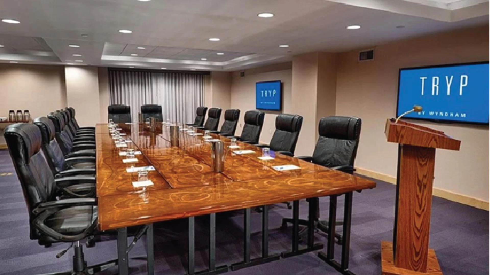 a conference room with a table and chairs