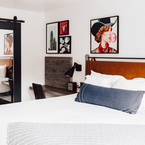 a bed with a white bed spread