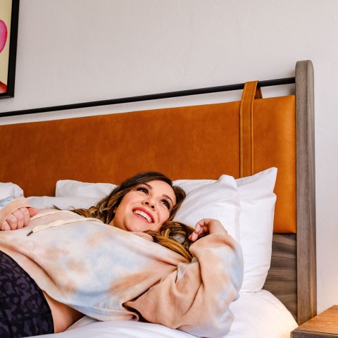 a person lying on a bed