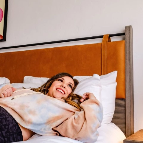 a person lying on a bed