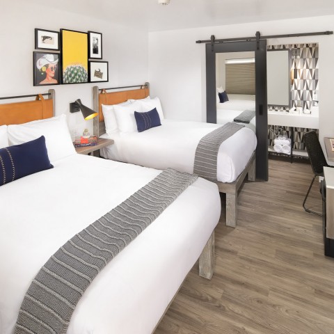 a hotel room with two beds