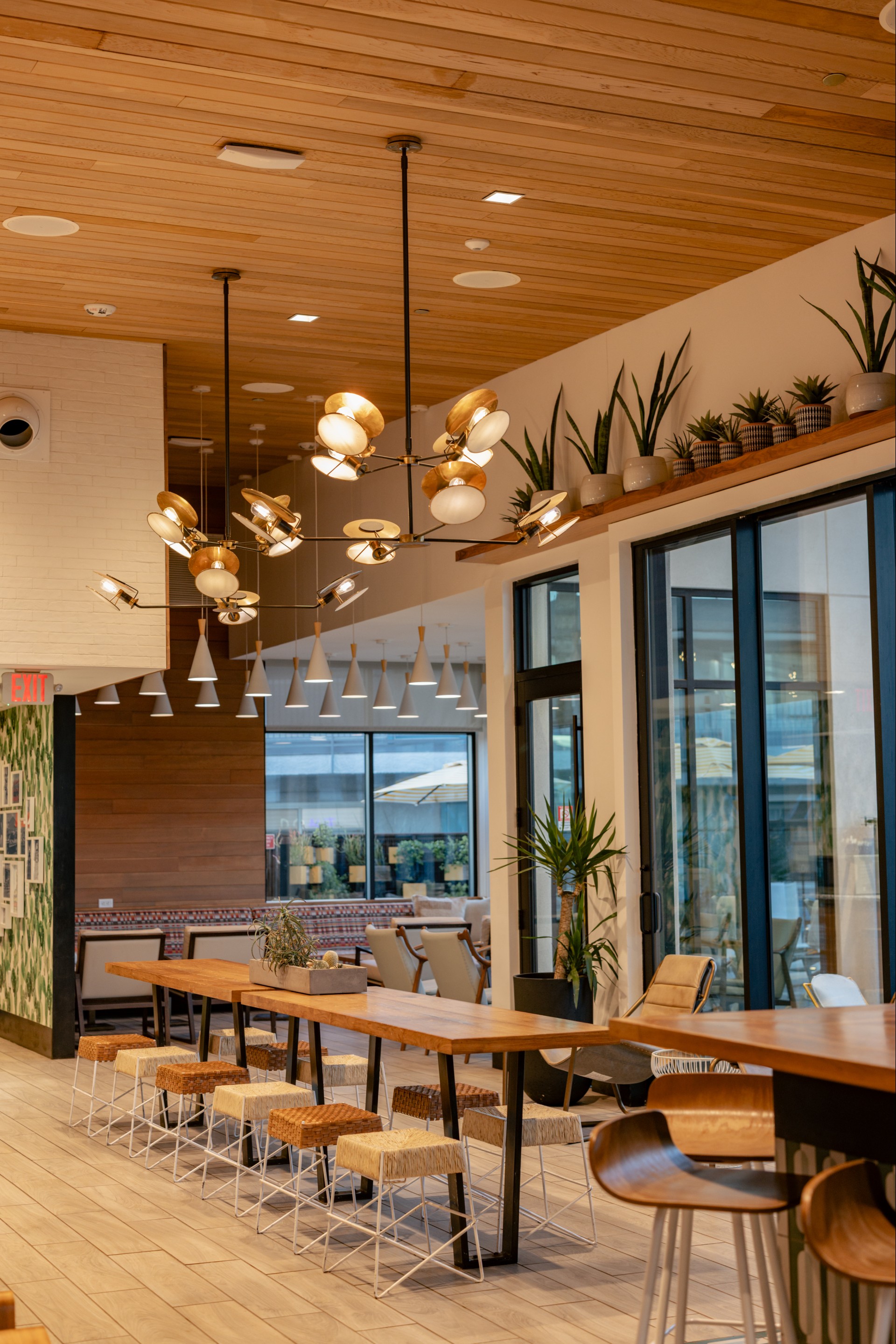 a room with tables and chairs and a chandelier
