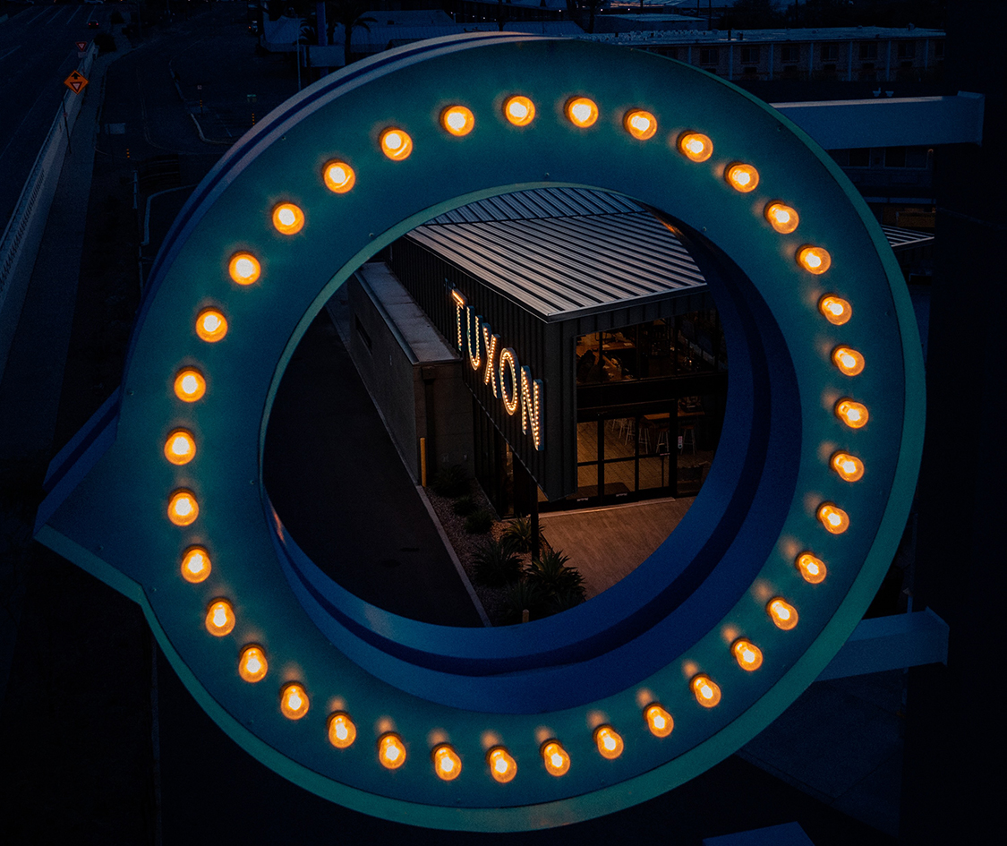 a circular sign with lights