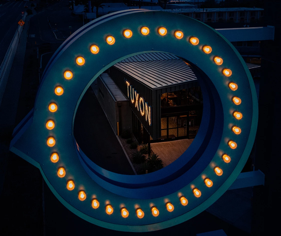 a circular sign with lights
