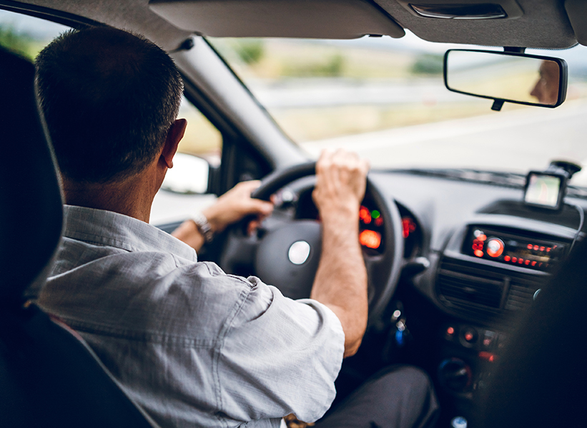 a man driving a car