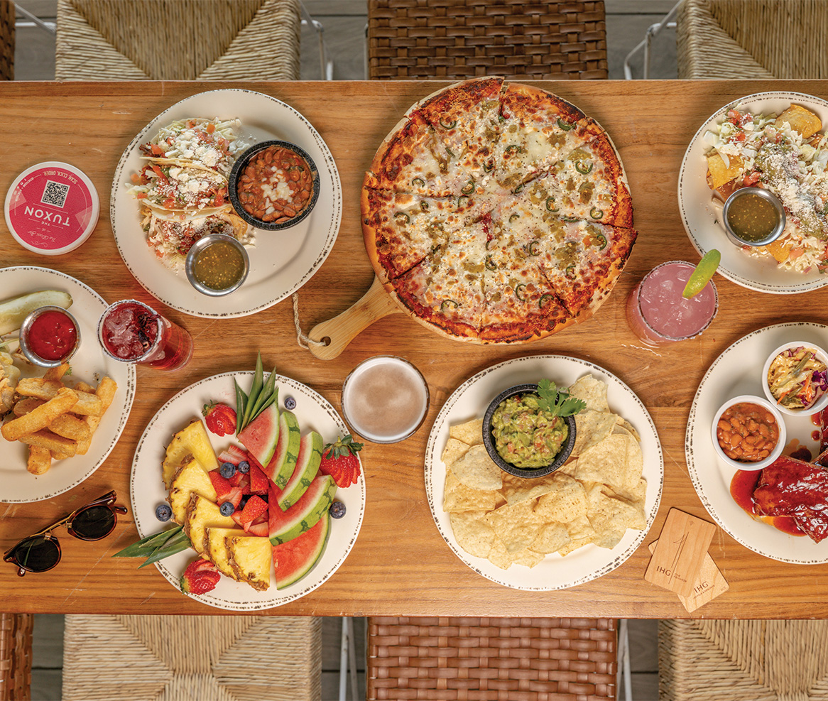 a table with plates of food and drinks